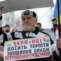 Foto: Kijevā iedzīvotāji protestē pret Porošenko